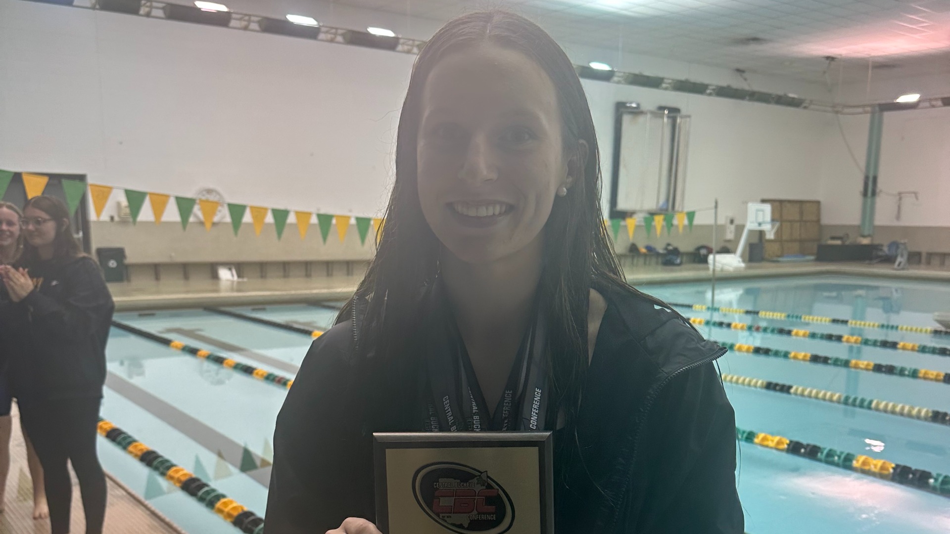 Slide 1 - Lola Derr named CBC Swimmer of the Year