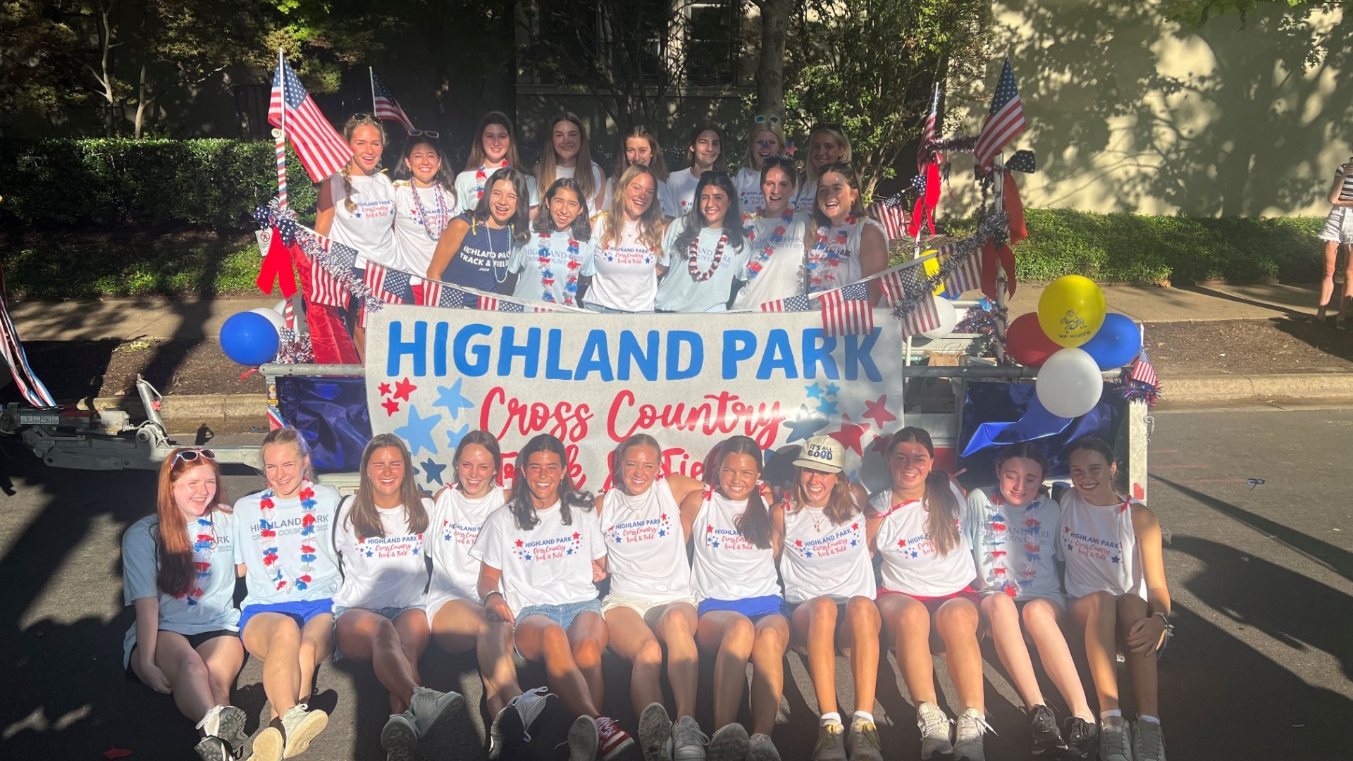 Slide 1 - Lady Scots Cross Country and Track & Field Teams Celebrate the 4th in the Park Cities Parade