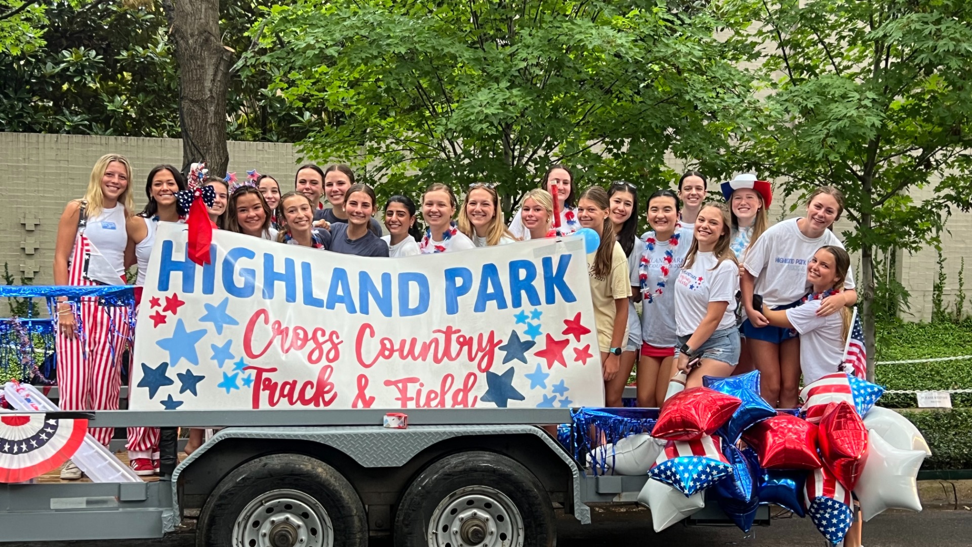 Slide 0 - Lady Scots Cross Country and Track & Field Teams Celebrate the 4th in the Park Cities Parade