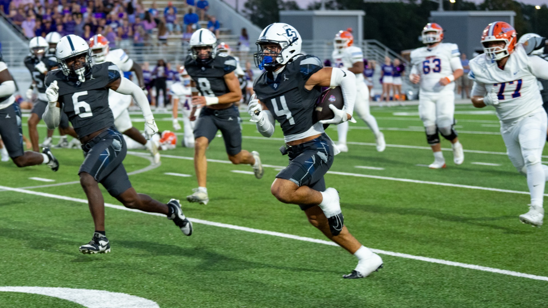 Slide 4 - FOOTBALL MOVES TO 5 - 0 AGAINST GRAND OAKS