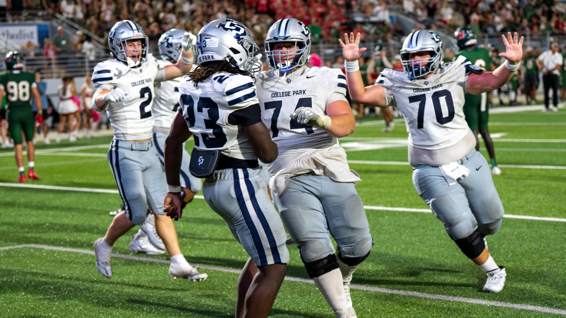 Slide 0 - FOOTBALL WINS THRILLER IN DOUBLE OVERTIME OVER THE WOODLANDS