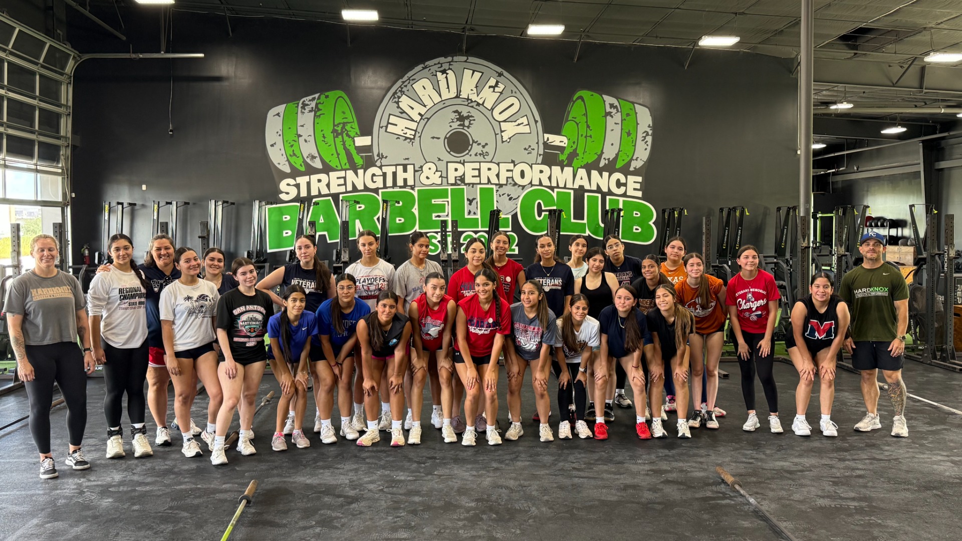 Slide 2 - Lady Charger Volleyball putting in strength and conditioning work at Hard Knox.