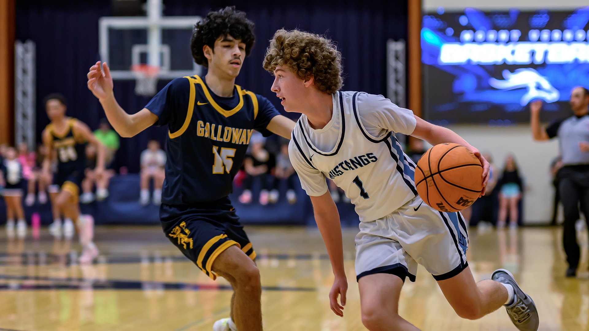 Slide 1 - VARSITY BOYS BASKETBALL NETS ROAD WIN OVER KING'S RIDGE, 54-45