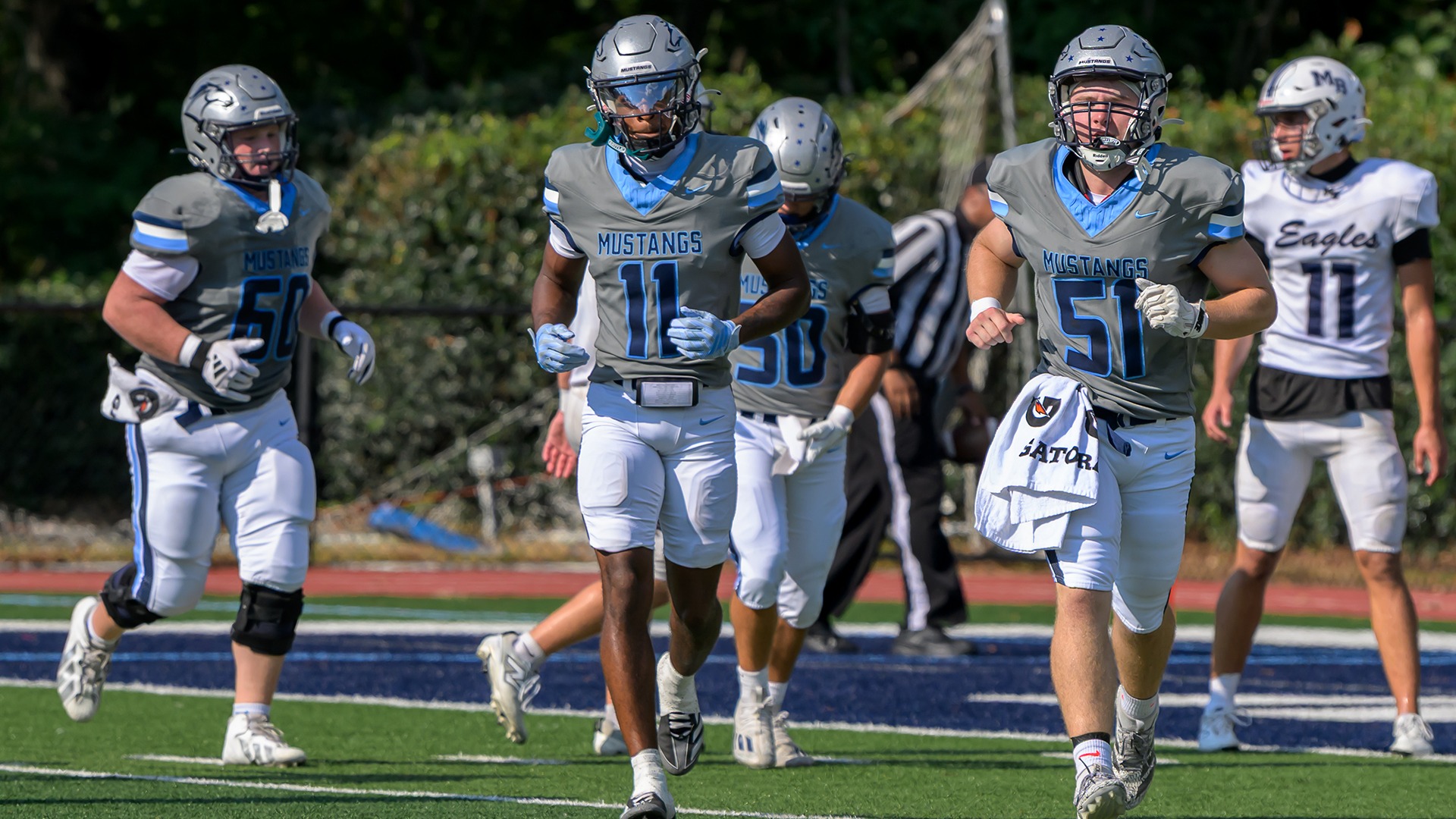 Slide 3 - VARSITY FOOTBALL CLAIMS REGION WIN OVER KING'S RIDGE, 42-16