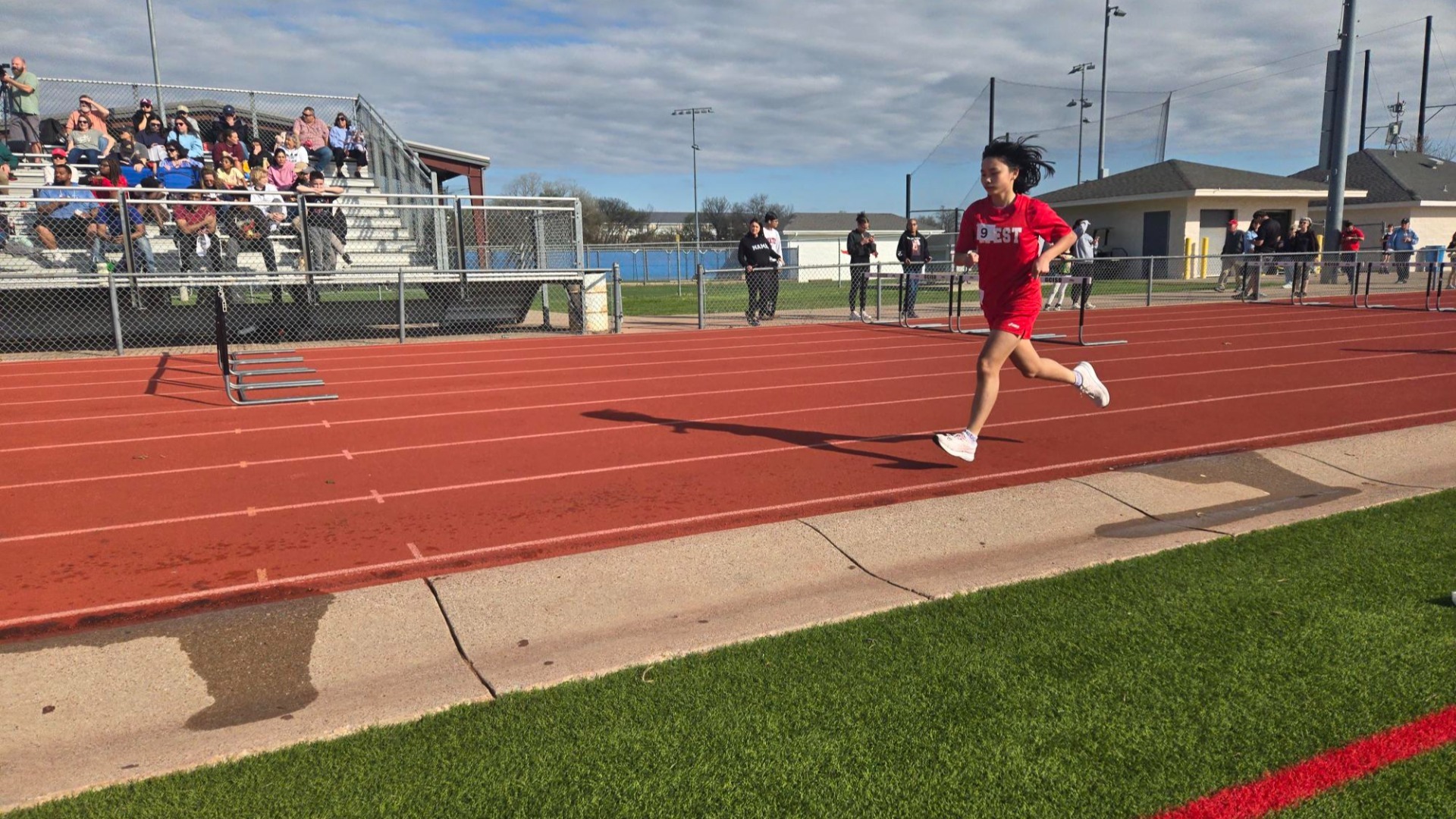 Slide 1 - Rachel Lin earning a first place finish at the Wrangler Relays!