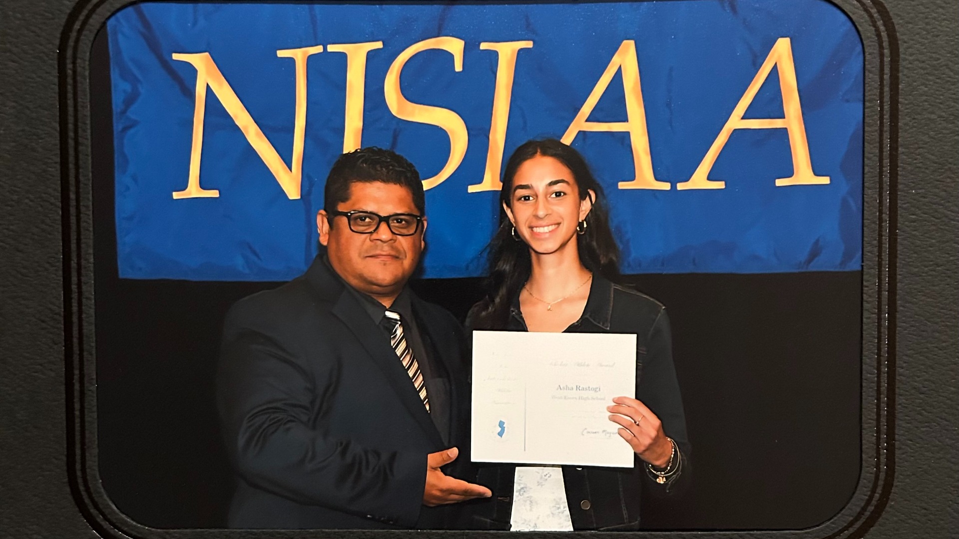 Slide 0 - Asha Rastogi receives NJSIAA Scholar Athlete Honor