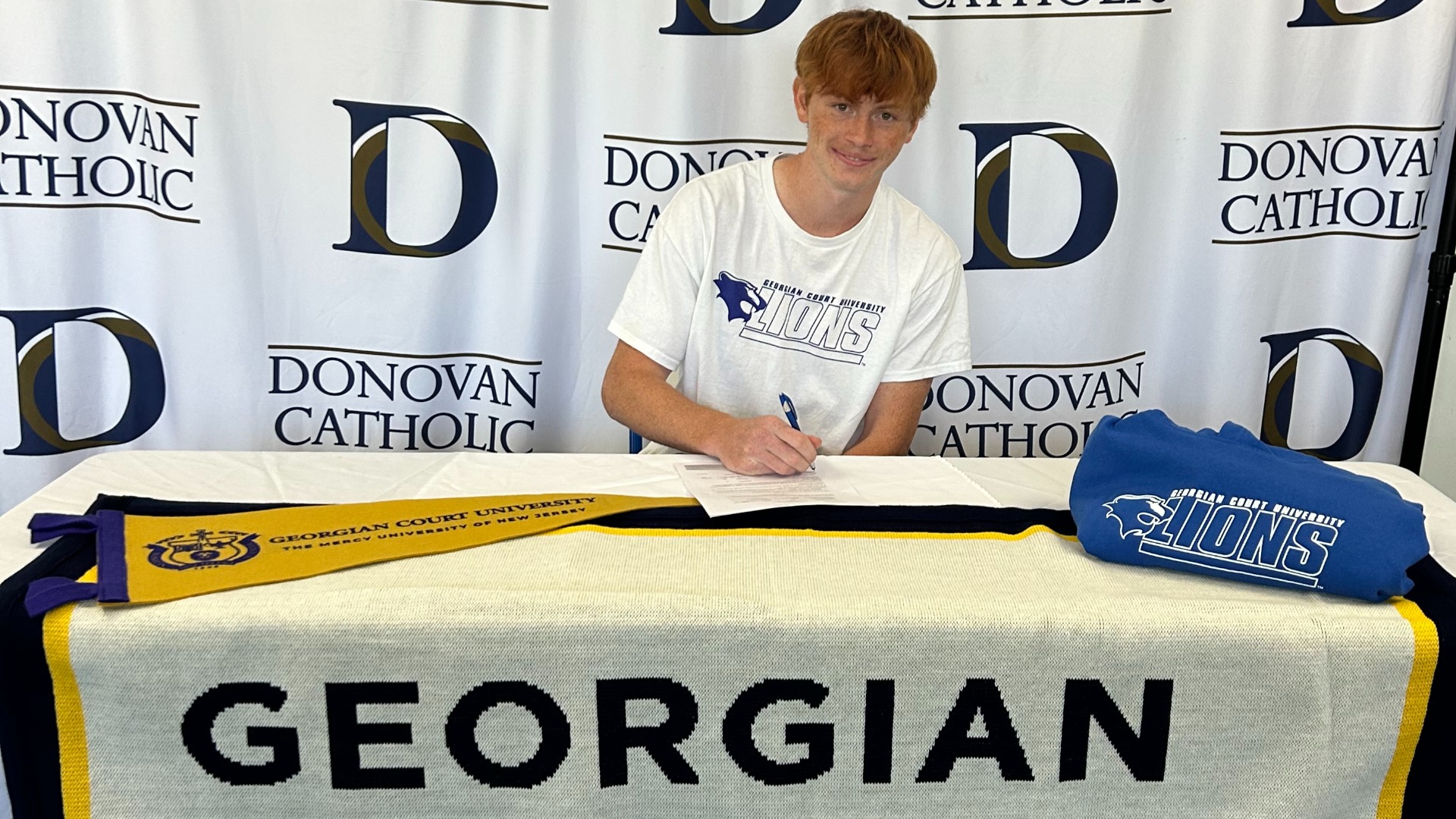Slide 1 - Brian Kutney, who holds  2 school records in Indoor & Outdoor track, signs NLI to continue running track at Georgian Court University