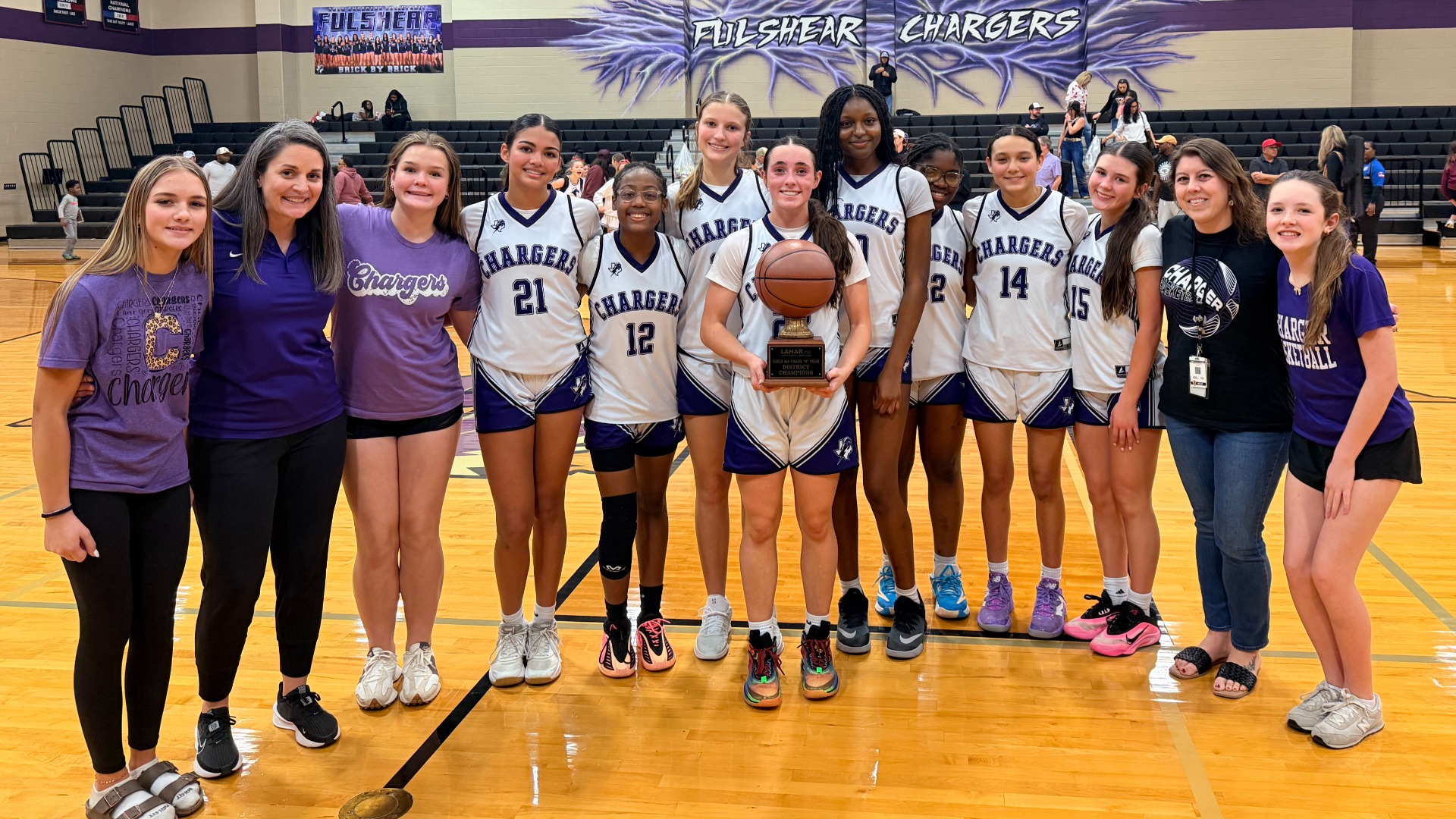 8th grade A girls basketball celebrating their district championship