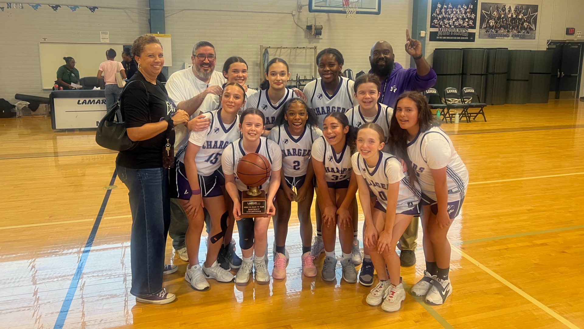 7th grade Girls B team basketball celebrating their championship