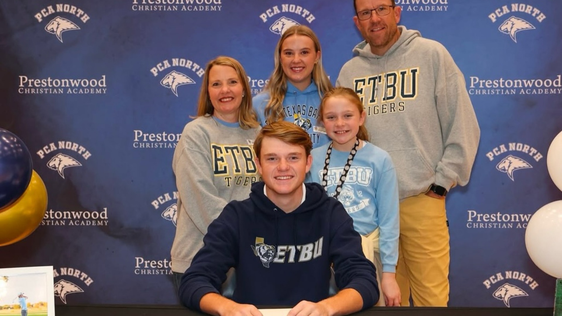 Making PCA North history, Coleman Bales becomes the school’s first golf college signee, celebrating with family after committing to East Texas Baptist