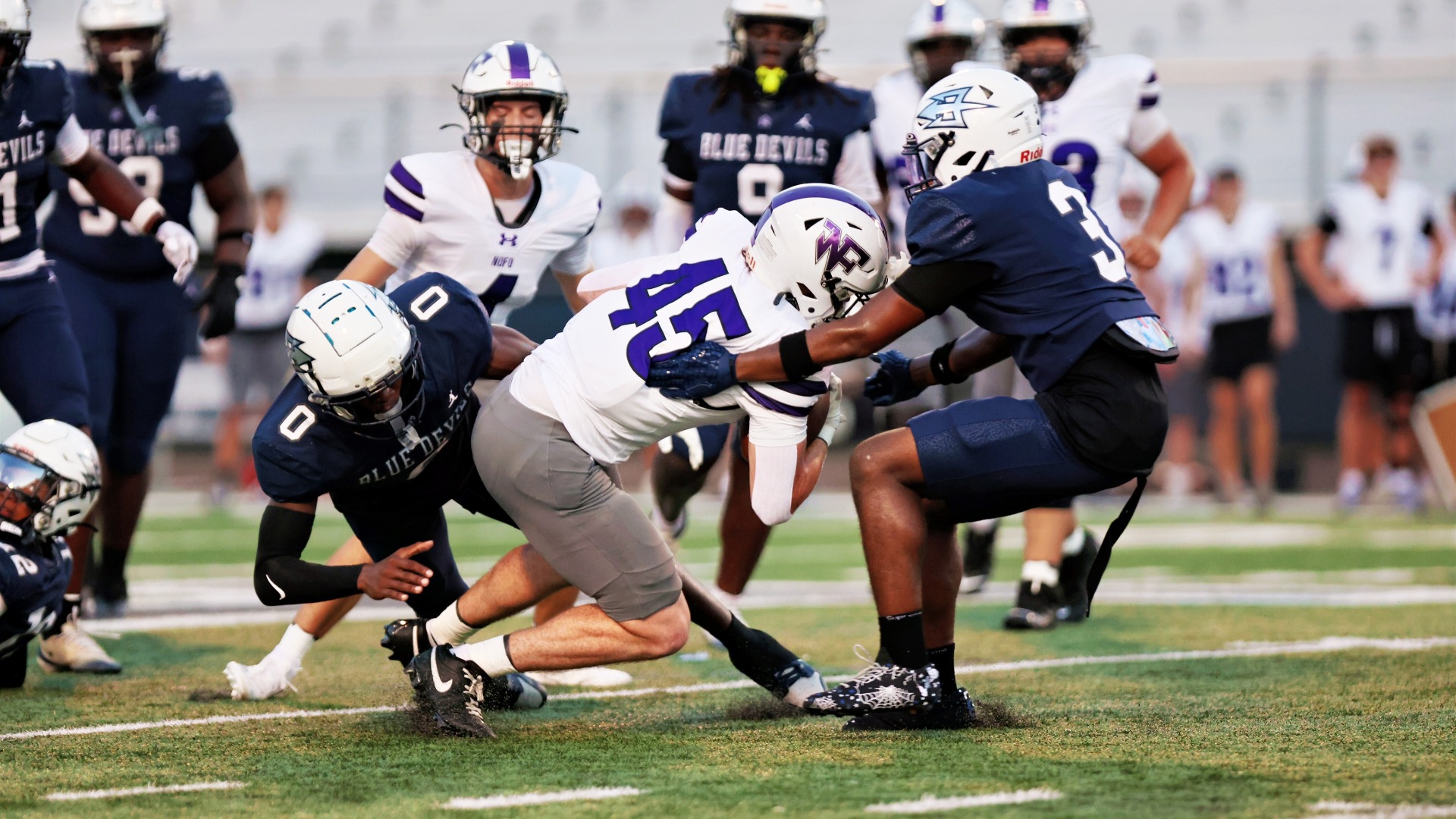 Varsity Football with the Tackle